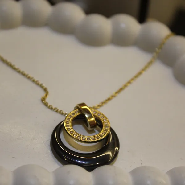 Gold_&_Black_Premium_Brass_And_American_Diamond_Neck_Pendant_For_Women