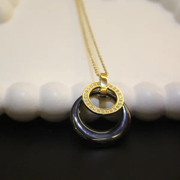 Gold_&_Black_Premium_Brass_And_American_Diamond_Neck_Pendant_For_Women