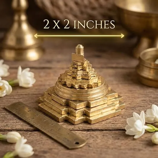 Auspicious_Brass_Shri_Meru_Yantra_-_3D_Pyramidal_Shree_Yantra_for_Wealth,_Prosperity_&_Vastu_Correction_(2x2_Inch,_Gold_Finish)