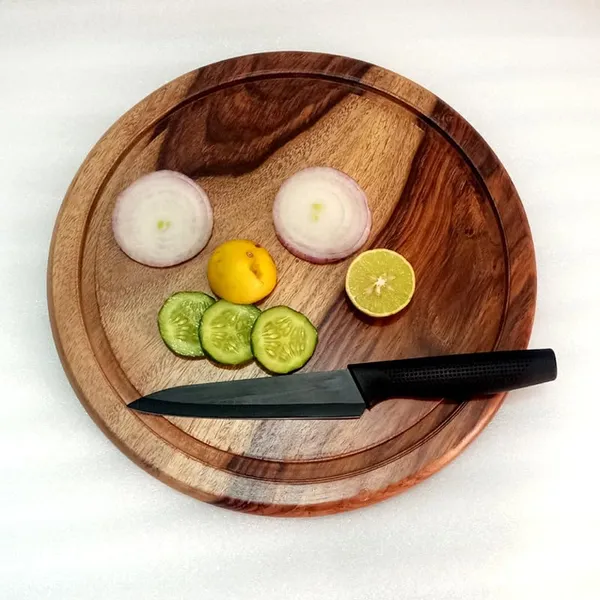 Brown_Wooden_Round_Chopping_Board,_Meat_Cutting_Board,_Pizza_Serving_Board,_Chakla_For_Roti,_Fish_Cutting_Board_For_Kitchen_11_Inch