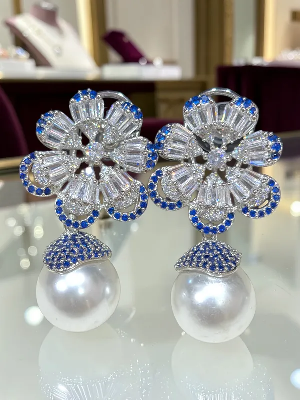 Next_to_real_diamond_dropping_studs_for_women_