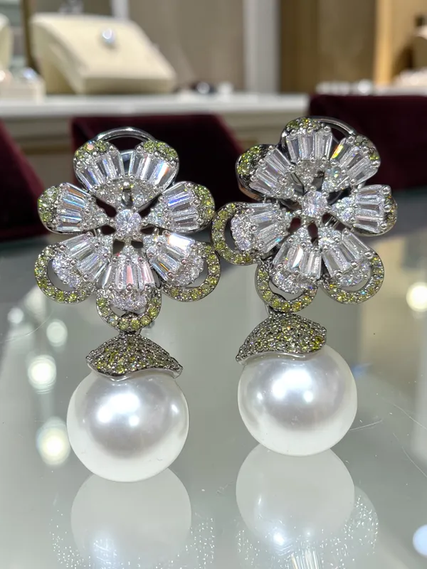 Next_to_real_diamond_dropping_studs_for_women_