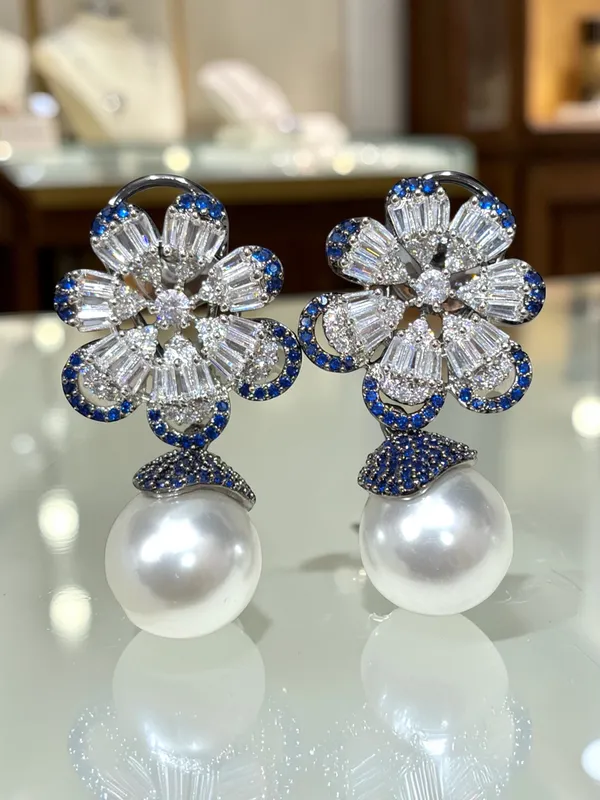 Next_to_real_diamond_dropping_studs_for_women_