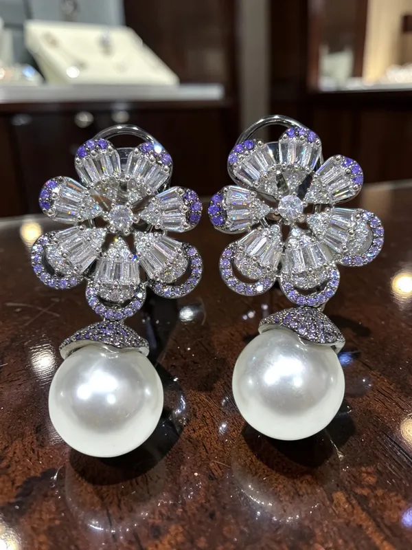 Next_to_real_diamond_dropping_studs_for_women_