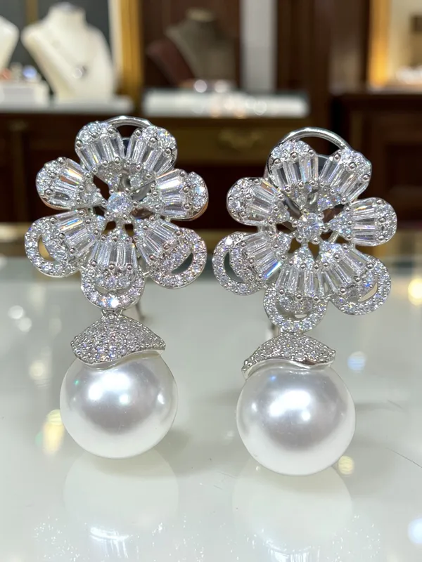 Next_to_real_diamond_dropping_studs_for_women_