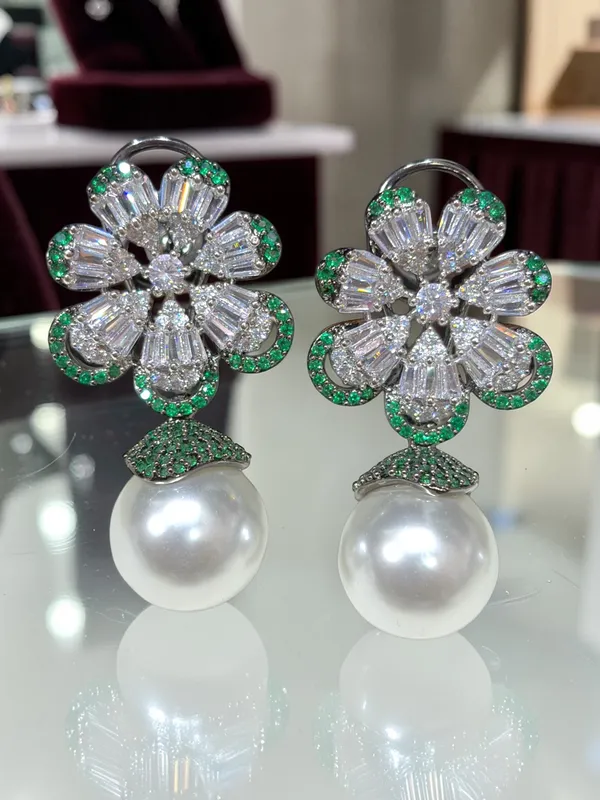 Next_to_real_diamond_dropping_studs_for_women_