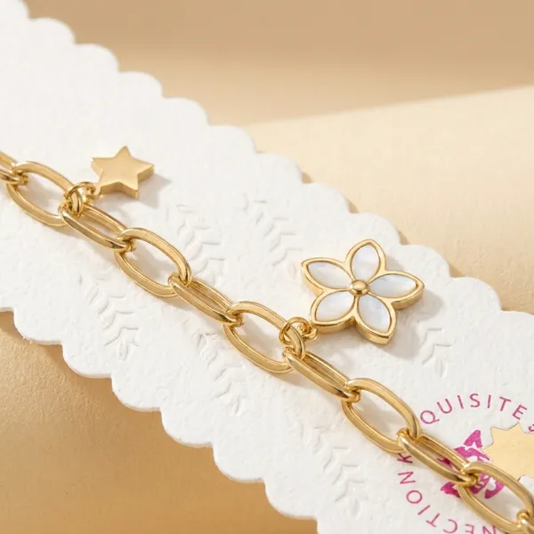 Gold-Toned_Chain_Bracelet_With_Floral_Charms