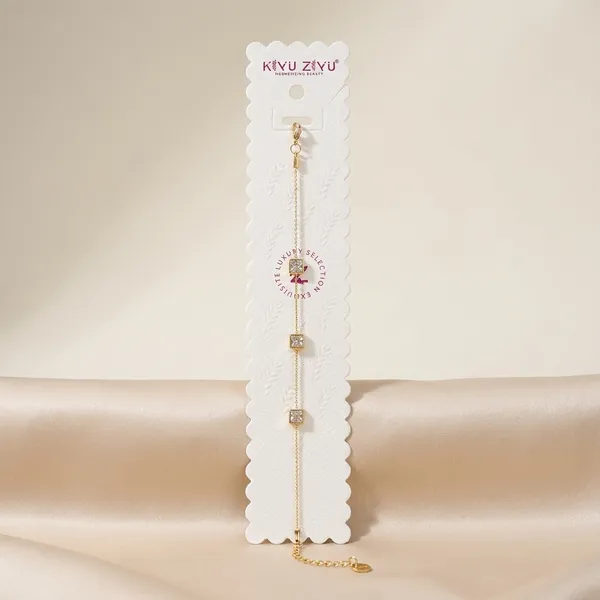 Gold-Toned_Delicate_Chain_Bracelet_With_Letter_Charms