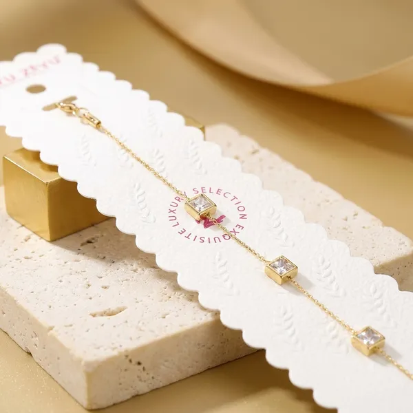 Gold-Toned_Delicate_Chain_Bracelet_With_Letter_Charms
