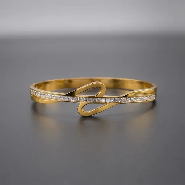 Elegant_Gold-Tone_Bangle_With_Crystal_Embellishments