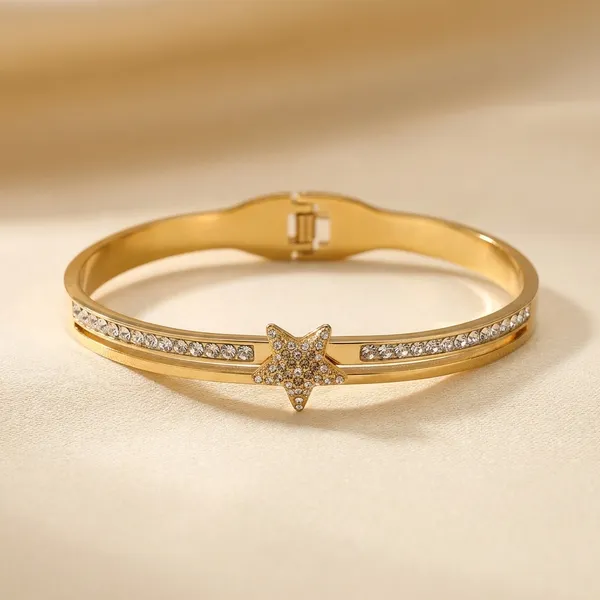 Gold-Toned_Star_Charm_Bracelet_With_Crystal_Embellishments
