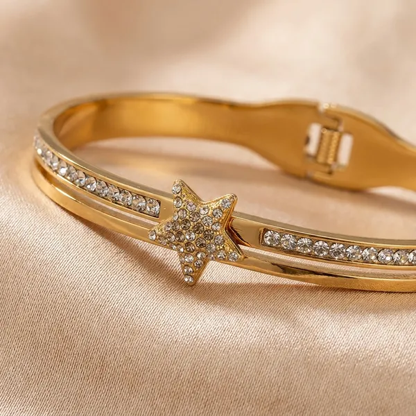 Gold-Toned_Star_Charm_Bracelet_With_Crystal_Embellishments