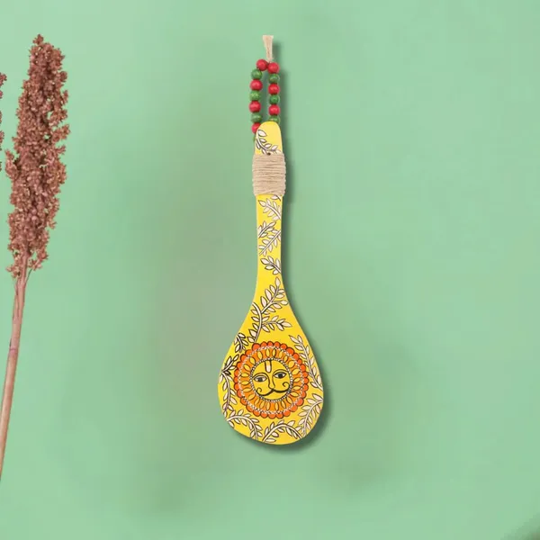 Indha_Hand-Painted_Wooden_Spoon_Décor_–_Madhubani_Sun_Art_|_Yellow_Wall_Accent_with_Jute_&_Beads_|_Travel-Friendly_Indian_Souvenir_|_Handmade_Gift