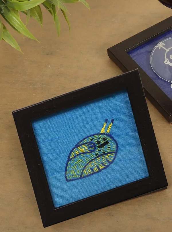 Indha_Hand_Embroidered_Glass_Coasters_–_Set_of_2_Handmade_Decorative_Drink_Coasters_for_Coffee_Table,_Dining,_and_Gifting_(Blue_Dupion_Snail)