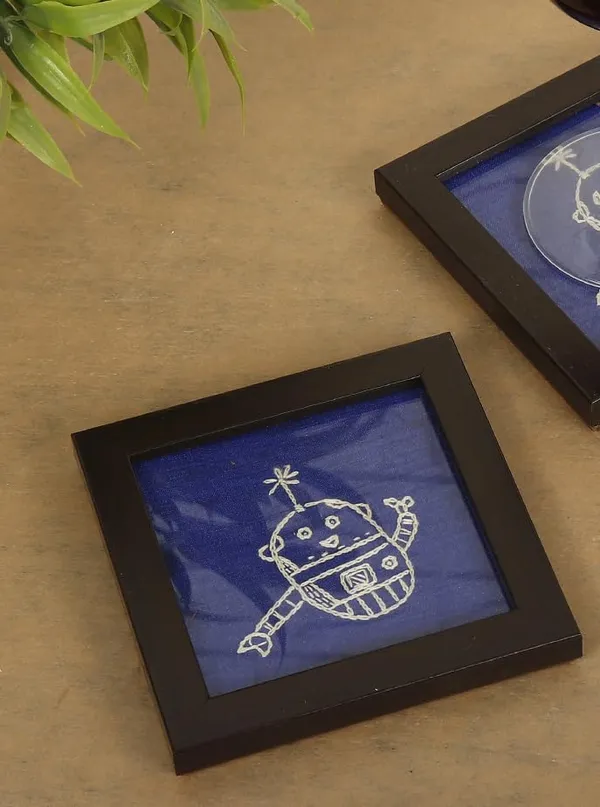 Indha_Hand_Embroidered_Glass_Coasters_–_Set_of_2_Handmade_Decorative_Drink_Coasters_for_Coffee_Table,_Dining,_and_Gifting_(Blue_Dupion_Robot_Doodle)