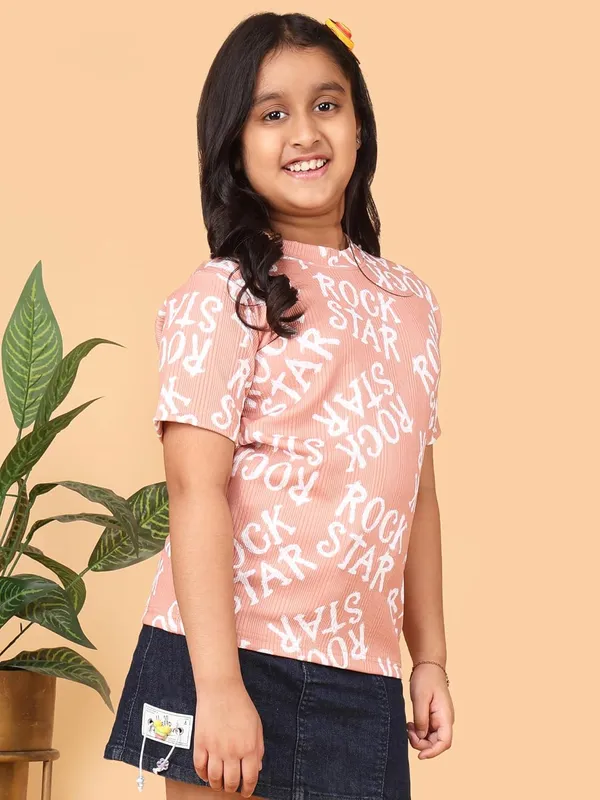 Peach_Cotton_Rock_Star_Print_Half_Sleeve_Round_Neck_T-Shirt,_Casual_Summer_Wear_For_Girls