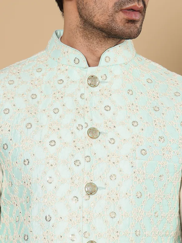 Men's_Ivory_Kurta_Pajama_&_Green_Embroidered_Nehru_jacket_(Set_of_3)