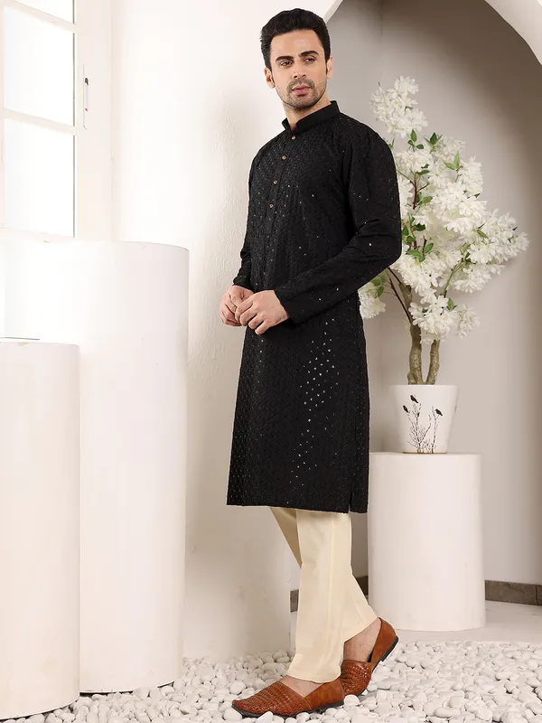 Men's_Black_Straight_Viscose_Silk_Kurta_with_Embroidered_Neckline_and_Motifs_and_Ivory_solid_trouser_style_churidar,_has_an_elasticated_waistband