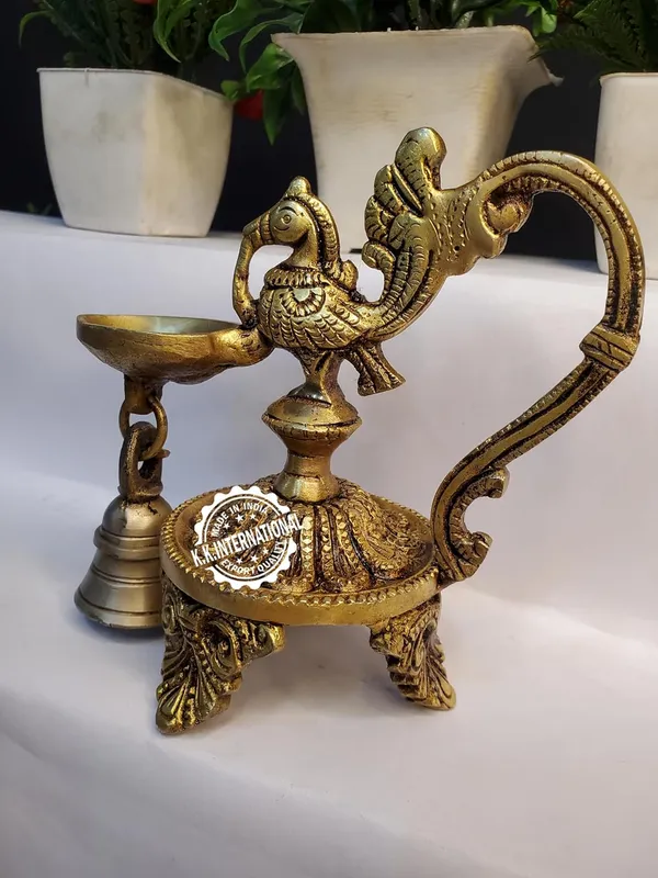 Brass_Peacock_Diya_With_Bell_Three_Leg_Base_(Set_Of_1)