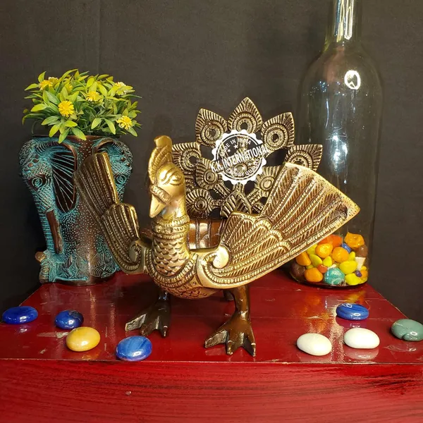 Handcrafted_Brass_Urli_With_Ethnic_Peacock_Design_–_Ideal_For_Home_Decoration