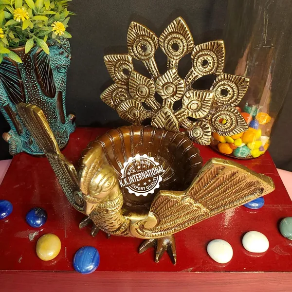Handcrafted_Brass_Urli_With_Ethnic_Peacock_Design_–_Ideal_For_Home_Decoration