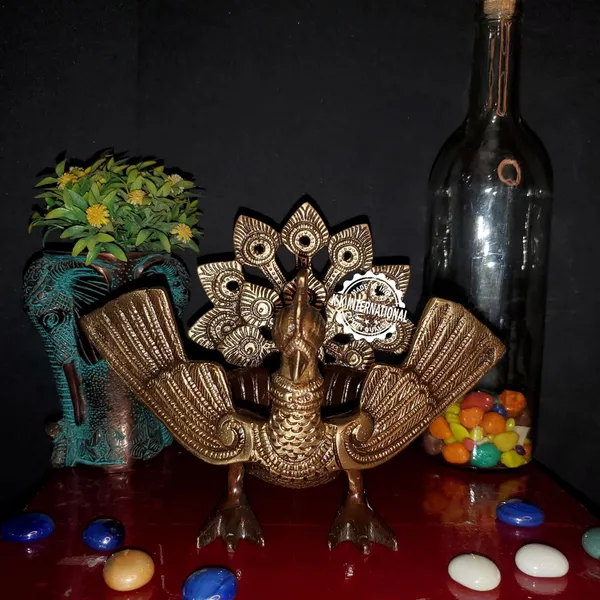 Handcrafted_Brass_Urli_With_Ethnic_Peacock_Design_–_Ideal_For_Home_Decoration