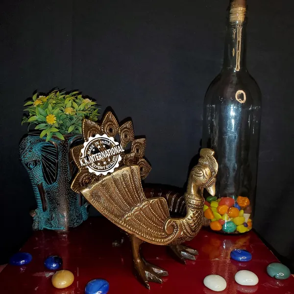 Handcrafted_Brass_Urli_With_Ethnic_Peacock_Design_–_Ideal_For_Home_Decoration