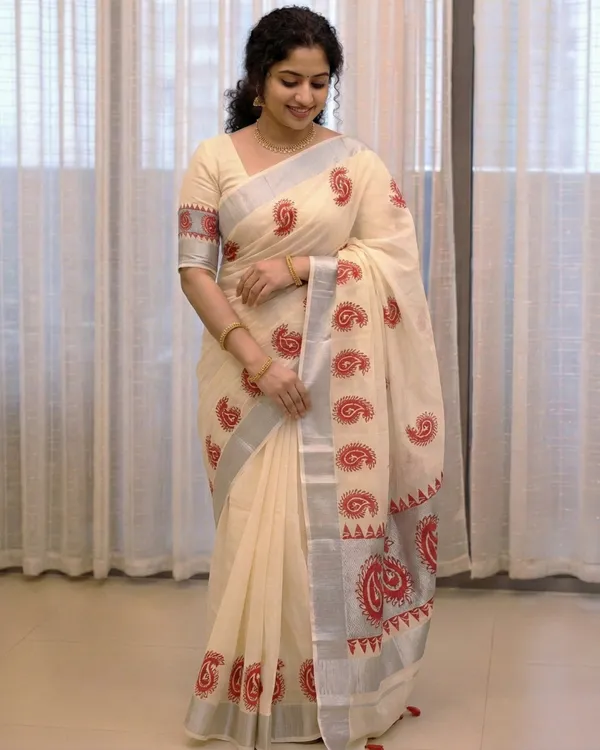 Ivory_Off_White_With_Red_Motifs_&_Silver_Border_Surya_Rekha_Kerala_Kasavu_Saree