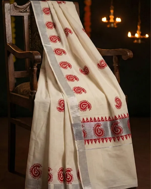 Ivory_Off_White_With_Red_Motifs_&_Silver_Border_Surya_Rekha_Kerala_Kasavu_Saree