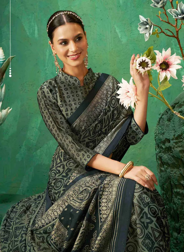 Dark_Green_Color_Exclusive_Brasso_Fabric_With_Striking_Adorned_With_Intricate_Geometric_Patterns_&_AGrand_Gold-Toned_Border_For_Festive_Occasions_&_Sophisticated_Evenings.