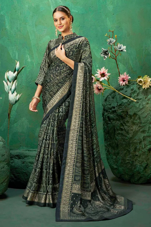 Dark_Green_Color_Exclusive_Brasso_Fabric_With_Striking_Adorned_With_Intricate_Geometric_Patterns_&_AGrand_Gold-Toned_Border_For_Festive_Occasions_&_Sophisticated_Evenings.