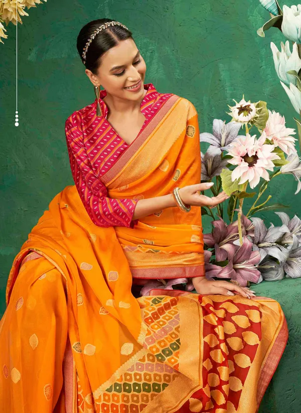 Orange_Exclusive_Brasso_Fabric_With_Vibrant_Color_Designed_With_Delicate_Self_Motifs_&_A_Luxurious_Contrasting_Border_Perfect_For_Festive_Events,_Weddings,_&_Bright_Celebrations.