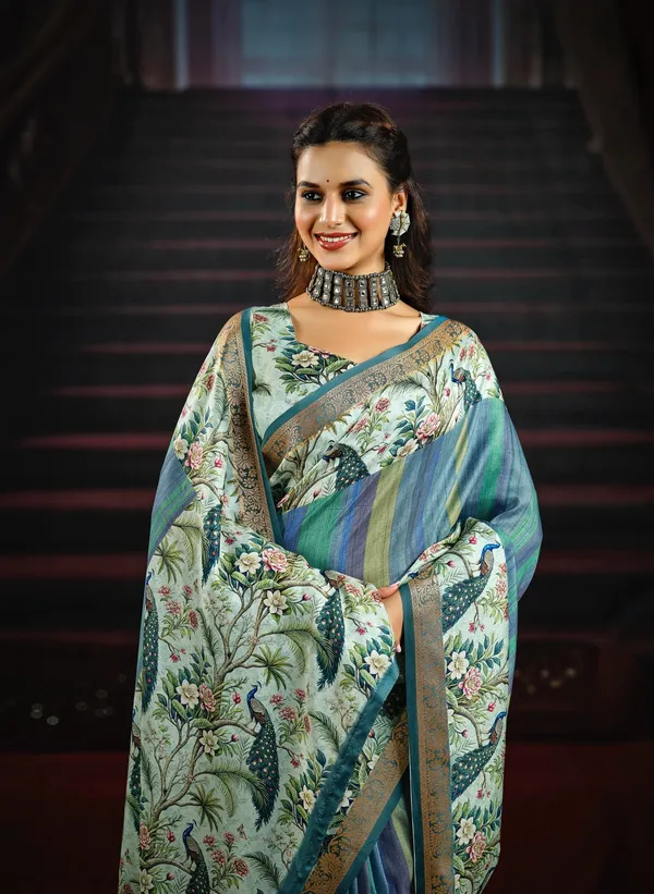 Teal_Beautiful_Saree_With_Vibrant_Peacock_&_Floral_Motifs,_Featuring_An_Artistic_Pallu_&_Border,_Perfect_For_Festive_&_Party_Occasions