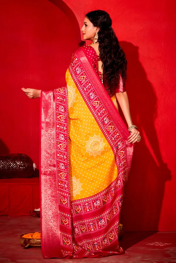 Yellow_&_Red_Pure_Silk_Fabric_With_Turmeric_Dual_Color_Combination_Of_Exclusive_Bandhej_Print_With_Rich_Look_Jacquard_Border_Exclusive_Look_Saree