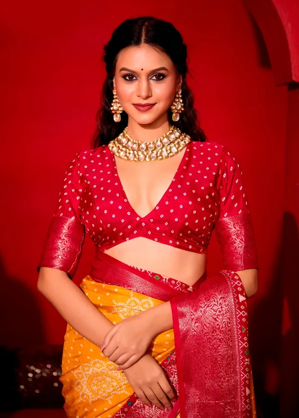 Yellow_&_Red_Pure_Silk_Fabric_With_Turmeric_Dual_Color_Combination_Of_Exclusive_Bandhej_Print_With_Rich_Look_Jacquard_Border_Exclusive_Look_Saree