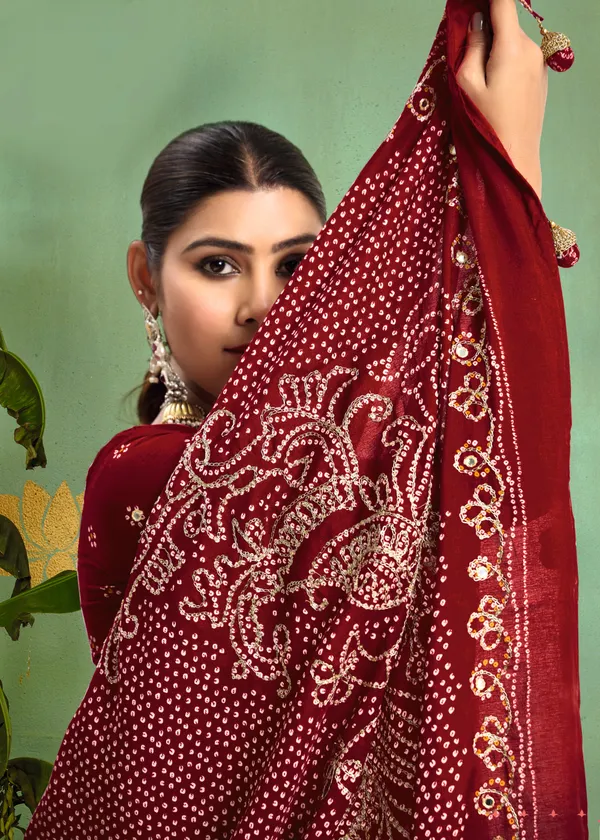 Maroon_Pure_Velvet_Tussar_Silk_Saree_With_Combination_&_Elegant_Aari_Jari_Handwork_With_Viscose_Jackquard_Border_&_Bandhani_Tussels