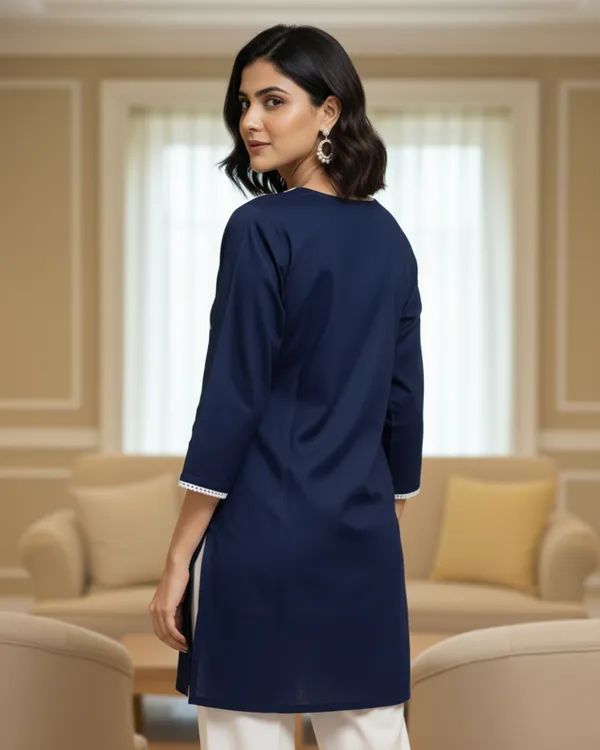 Elegantly_crafted_rayon_chikankari_short_kurti_featuring_intricate_white_embroidery