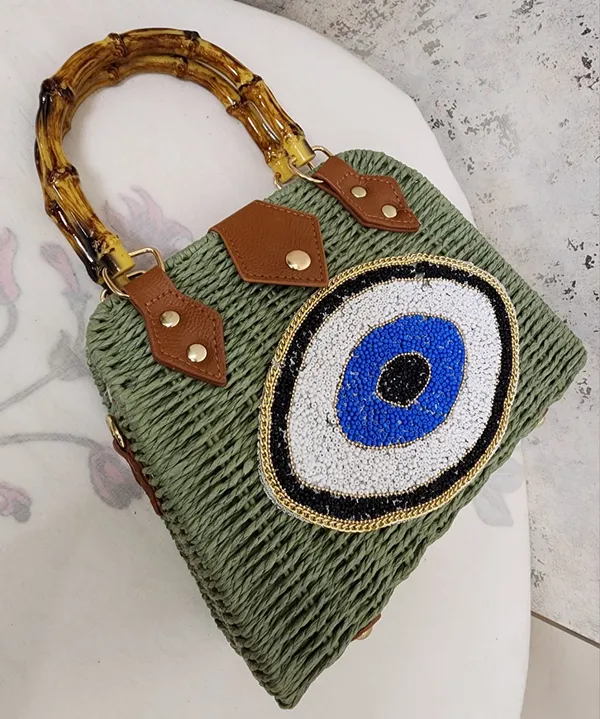 Woven_Green_Straw_Top_Handle_Bag_with_Beaded_Evil_Eye_&_Bamboo_Handles