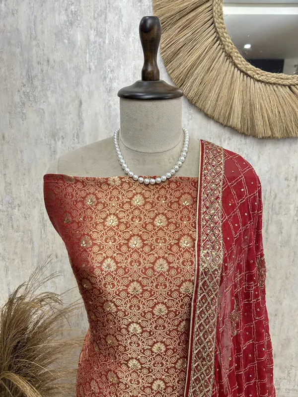 Festive_Elegance_Unstiched_Suit_Rust_Orange_With_Golden_Embroidery