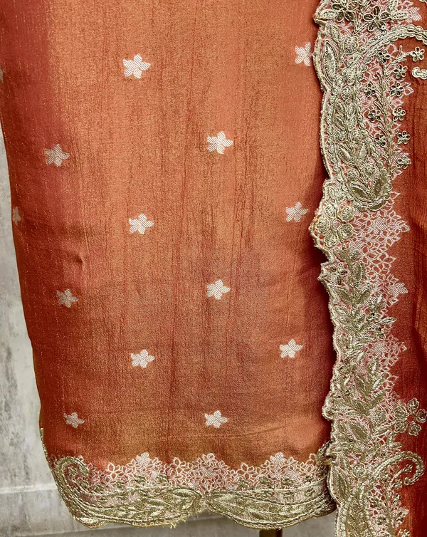 Zari_E_Gul_Tissue_Unstitched_Suit_With_Potli_Rust_Orange_With_Golden_Embroidery