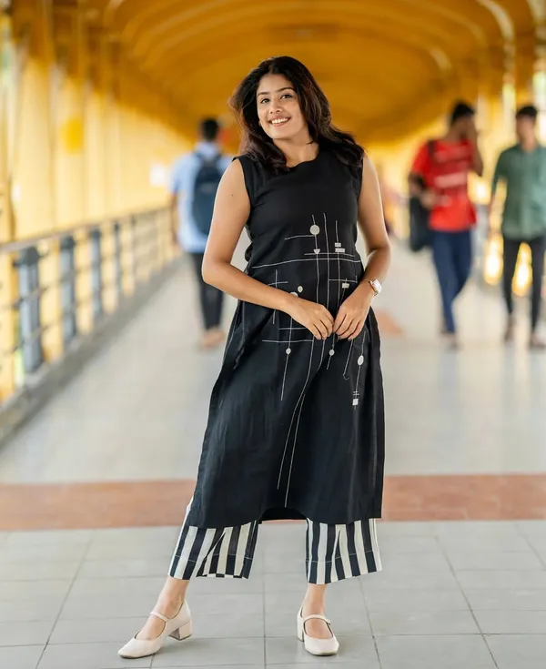 Black_kurti_Plazzo_with_intricate_embroidery_work__perfect_for_any_auspicious_occasion.