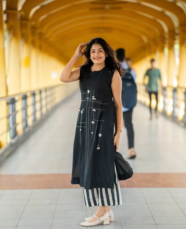 Black_kurti_Plazzo_with_intricate_embroidery_work__perfect_for_any_auspicious_occasion.