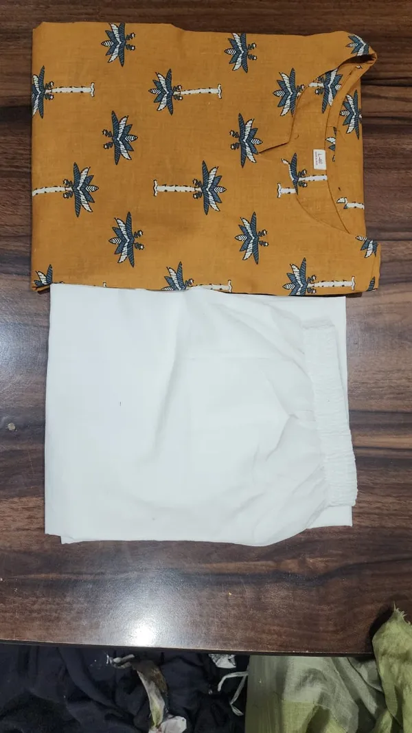 Featuring_Ivory_Pakistani_Suit_which_is_beautifully_decorated_with_new_prints.
