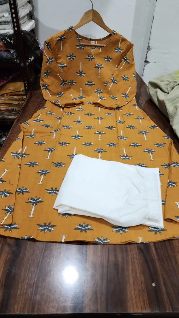 Featuring_Ivory_Pakistani_Suit_which_is_beautifully_decorated_with_new_prints.