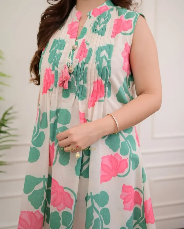 nwind_in_style_with_out_relaxed_fitted_printed_kurta_set_in_pure_cotton_,_while_the_kurta_creates_an_effortless_chic_look_with_printex_and_tassel__detailing.