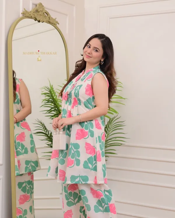 nwind_in_style_with_out_relaxed_fitted_printed_kurta_set_in_pure_cotton_,_while_the_kurta_creates_an_effortless_chic_look_with_printex_and_tassel__detailing.