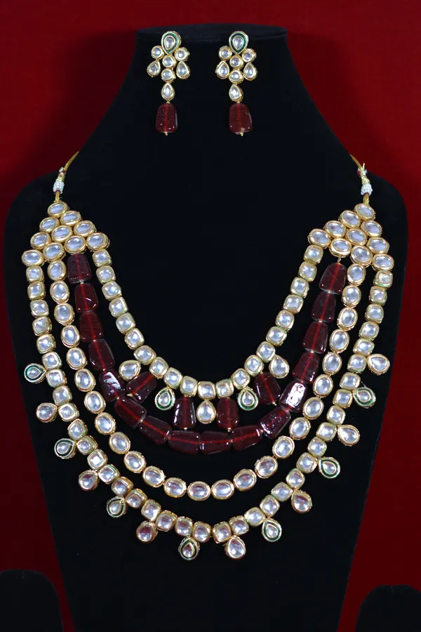 Red_And_Gold_Gold_Plated_Multi_Layer_Kundan_Necklace_And_Earrings_Set_(Pack_Of_3)