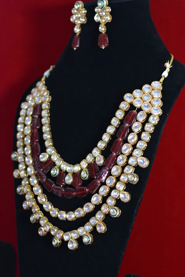 Red_And_Gold_Gold_Plated_Multi_Layer_Kundan_Necklace_And_Earrings_Set_(Pack_Of_3)