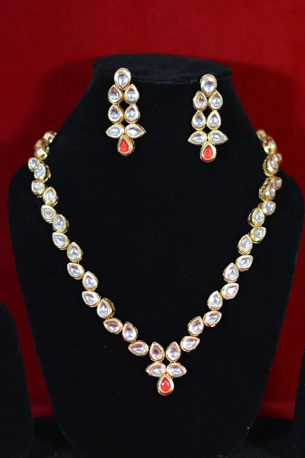 Gold_Designer_Kundan_Necklace_Set_With_Red_Accent_Stone_(Pack_Of_3)