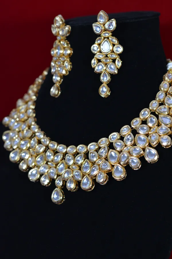 Gold_Handcrafted_Bridal_Kundan_Necklace_Set_With_Pear_Shaped_Stones_(Pack_Of_3)